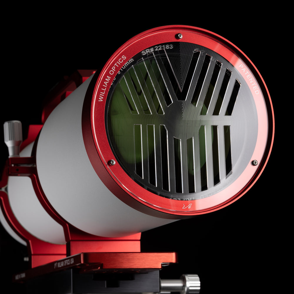 William Optics Fluorostar 132 telescope with a sleek black optical tube and mounting accessories against a neutral background.